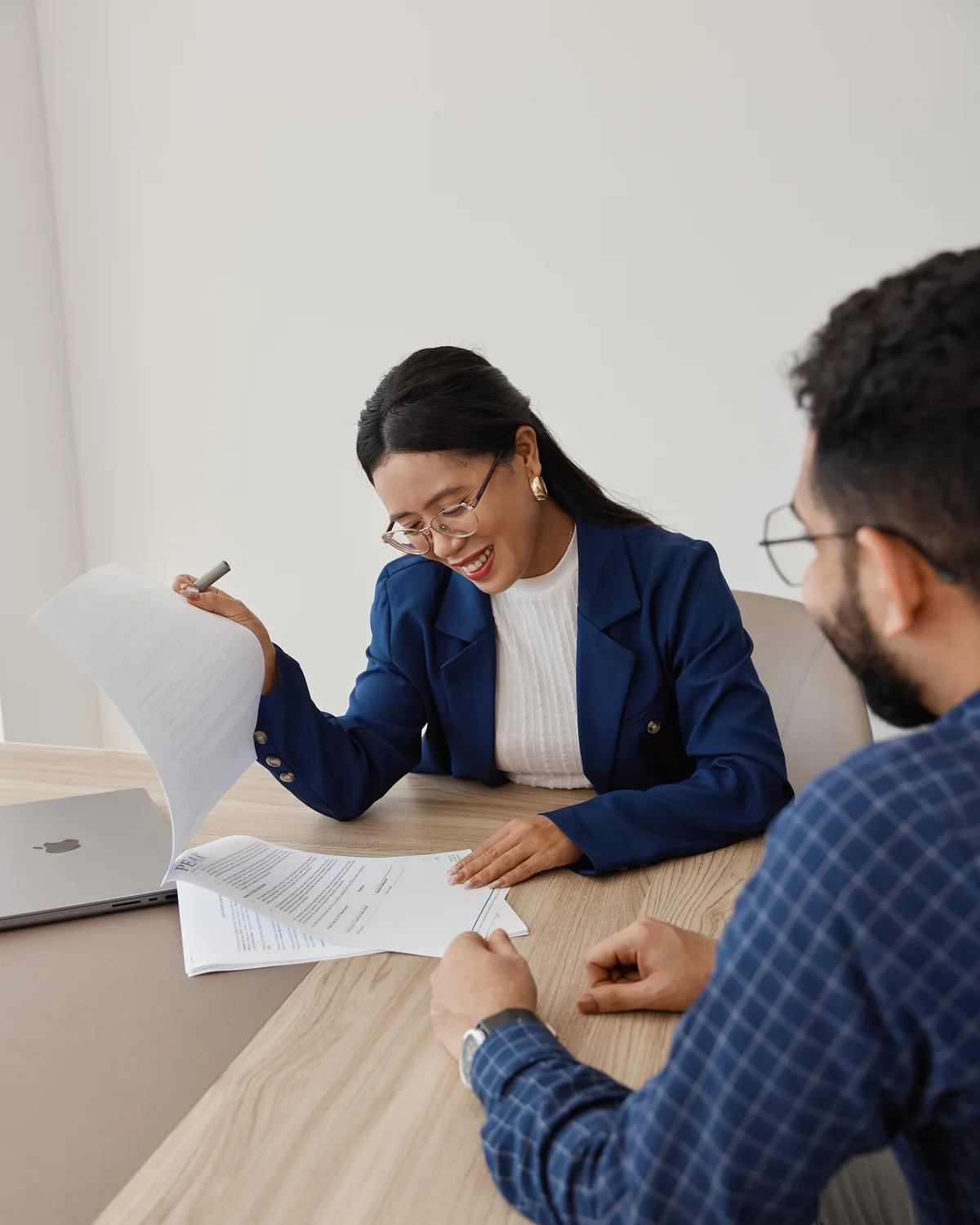 April Moral onboarding a new team member, contracts on the table